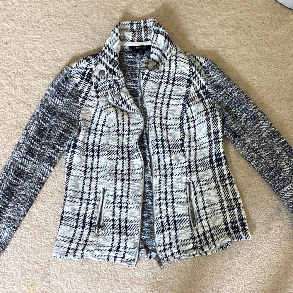 Plaid black and white jacket.